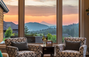 a view of the mountains around Boone from inside a cozy home with tall windows